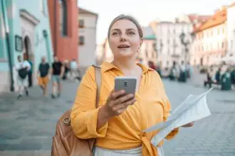 Beautiful girl tourist traveler using smart phone